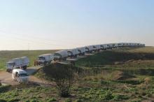 Aid trucks line a road before their departure for Damascus, February 17, 2016. PHOTO BY REUTERS/Syrian Arab Red Crescent