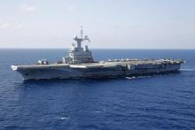 France's flagship Charles de Gaulle aircraft carrier makes it way through the Mediterranean Sea while on mission, March 26, 2011. PHOTO BY REUTERS/Benoit Tessier