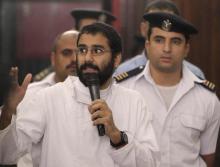 Activist Alaa Abdel Fattah speaks in front of a judge at a court during his trial in Cairo, November 11, 2014. PHOTO BY REUTERS/Al Youm Al Saabi Newspaper
