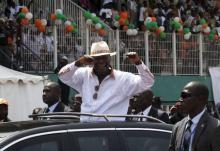 Ivory Coast's President Alassane Dramane Ouattara waves as he arrives for his investiture as the presidential candidate of the Rally of Houphouetists for Democracy and Peace (RHDP) ruling coalition at Felix Houphouet-Boigny Stadium in Abidjan, April 25, 2015. PHOTO BY REUTERS/Luc Gnago