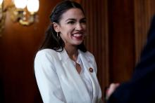 Rep. Alexandria Ocasio-Cortez (D-NY) waits for a ceremonial swearing-in picture on Capitol Hill in Washington, U.S., January 3, 2019. PHOTO BY REUTERS/Joshua Roberts