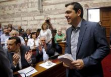 Greek Prime Minister Alexis Tsipras arrives for a session of the ruling Syriza's leftist party parliamentary group at the Parliament building in Athens, Greece, July 10, 2015. PHOTO BY REUTERS/Jean-Paul Pelissier
