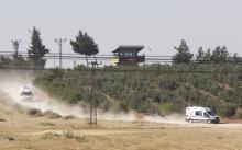 Ambulances leave from the Dag military post, which was attacked by Islamic State militants on Thursday, on the Turkish-Syrian border near Kilis, Turkey, July 24, 2015. PHOTO BY REUTERS/Murad Sezer