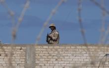 An Egyptian soldier guards the border between Egypt and southern Gaza Strip
