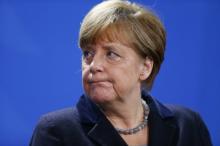 German Chancellor Angela Merkel addresses a news conference with Ukrainian President Petro Poroshenko at the Chancellery in Berlin, Germany, February 1, 2016. PHOTO BY REUTERS/Hannibal Hanschke