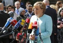 German Chancellor Angela Merkel gives a statement after her visit to a refugee camp near the Federal Office for Migration and Refugees at Berlin's Spandau district, Germany, September 10, 2015. PHOTO BY REUTERS/Fabrizio Bensch