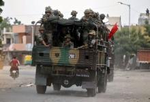 Army soldiers patrol after clashes between police and protesters in Ahmedabad, India, August 26, 2015. PHOTO BY REUTERS/Amit Dave