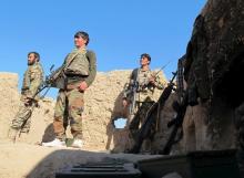 Afghan National Army (ANA) soldiers stand at an outpost in Helmand province, December 20, 2015. PHOTO BY REUTERS/Abdul Malik