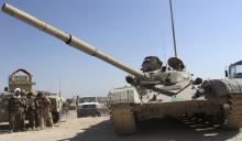 An armoured vehicle belonging to the Iraqi army patrols in Jurf al-Sakhar, October 25, 2014. PHOTO BY REUTERS/Stringer