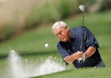 Former champion Arnold Palmer of the U.S hits from a sand trap during the annual Masters Par 3 golf tournament at the Augusta National Golf Club in Augusta, Georgia, April 9, 2008. PHOTO BY REUTERS/Hans Deryk