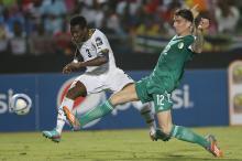 Ghana's Asamoah Gyan kicks the ball past Algeria's Carl Medjani to score the winning goal during their 2015 African Cup of Nations Group C soccer match in Mongomo, January 23, 2015. PHOTO BY REUTERS/Mike Hutchings