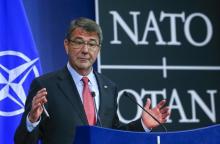 U.S. Secretary of Defense Ash Carter gestures during a news conference during a NATO Defence Ministers meeting at the Alliance's headquarters in Brussels, February 11, 2016. PHOTO BY REUTERS/Yves Herman