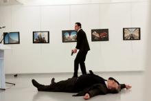 Russian Ambassador to Turkey Andrei Karlov lies on the ground after he was shot by unidentified man at an art gallery in Ankara. PHOTO BY REUTERS/Hasim Kilic