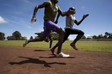 Athletes sprint during a training session on a dirt track in the town of Iten in western Kenya, November 13, 2015. PHOTO BY REUTERS/Siegfried Modola