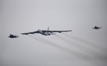 A U.S. Air Force B-52 (C) flies over Osan Air Base in Pyeongtaek, South Korea, January 10, 2016. PHOTO BY REUTERS/Kim Hong-Ji