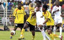 Kenya's Macdonald Mariga (C) attempts to dribble the ball past Uganda's Eugine Sepuya and Nestroy Kizito during their 2012 African Nations Cup qualifying soccer match at the Nyayo staduim in Kenya's capital Nairobi, October 9, 2010. PHOTO BY REUTERS/Thomas Mukoya