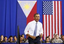 U.S. President Barack Obama walks out to speak to military troops at the Fort Bonifacio Gymnasium in Manila