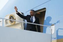 U.S. President Barack Obama waves as he boards Air Force One for travel to Kenya and Ethiopia from Joint Base Andrews, Maryland, July 23, 2015. PHOTO BY REUTERS/Jonathan Ernst