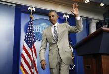 President Barack Obama departs the White House Press Briefing Room after addressing reporters in Washington
