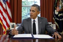 U.S. President Barack Obama delivers remarks to reporters before signing a federal Highway Trust Fund bill into law in the Oval Office at the White House in Washington, July 31, 2015. PHOTO BY REUTERS/Jonathan Ernst