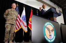 General Raymond Thomas (L) stands by as U.S. President Barack Obama speaks to active service members and their families during his visit to MacDill Air Force Base, home to U.S. Central Command and U.S. Special Operations Command, in Tampa, Florida, U.S., December 6, 2016. PHOTO BY REUTERS/Kevin Lamarque