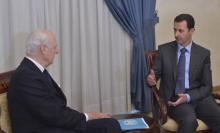 Syria's President Bashar al-Assad (R) meets United Nations Syria mediator Staffan de Mistura, in Damascus February 11, 2015, in this picture released by Syria's national news agency SANA. photo by REUTERS/SANA/Handout via Reuters