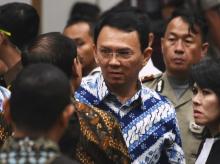 Jakarta's Christian governor Basuki Tjahaja Purnama, popularly known as Ahok, speaks to his lawyers after the guilty verdict in his blasphemy trial in Jakarta, May 9, 2017. PHOTO BY REUTERS/Bay Ismoyo