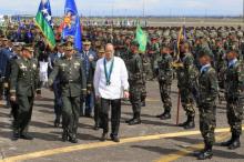 Philippines' President Benigno Aquino reviews a military platoon upon arrival during the 80th founding anniversary of the Armed Forces of the Philippines held inside Clark Air Base, formerly a U.S. base, in Angeles city, Pampanga province, north of Manila, December 21, 2015. PHOTO BY REUTERS/Romeo Ranoco