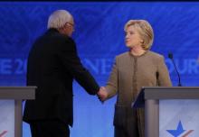 Democratic U.S. presidential candidate Senator Bernie Sanders shakes hands with rival Hillary Clinton at the conclusion of the Democratic presidential candidates debate at St. Anselm College in Manchester, New Hampshire, December 19, 2015. PHOTO BY REUTERS/Brian Snyder 