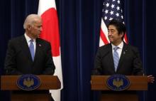 U.S. Vice President Joe Biden (L) and Japan's Prime Minister Shinzo Abe attend a joint news conference following their meeting at the prime minister's official residence in Tokyo in this file photograph dated December 3, 2013. PHOTO BY REUTERS/Toru Hanai