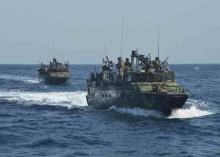 Riverine command boats assigned to Coastal Riverine Squadron (RIVRON) 4, transit open water in the 5th fleet area of responsibilities in this June 27, 2013 handout photo provided by the U.S. Navy, January 12, 2016. PHOTO BY REUTERS/Mass Communication Specialist 1st Class Peter Lewis