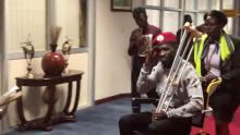 Bobi Wine is seen in a wheelchair just before his departure at Entebbe International Airport, in Entebbe, Uganda, August 31, 2018 in this still image taken from a social media video on September 1, 2018. PHOTO BY REUTERS/Nicholas Opiyo