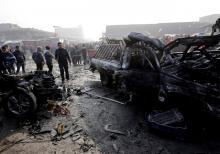 Wreckage is seen at the site of a car bomb attack at a vegetable market in eastern Baghdad, Iraq, January 8, 2017. PHOTO BY REUTERS/Wissm al-Okili