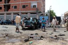 People check the site of a suicide bombing in the southern port city of Aden, Yemen, May 23, 2016. PHOTO BY REUTERS/Fawaz Salman