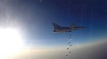 A still image, taken from video footage and released by Russia's Defence Ministry on August 16, 2016, shows a Russian Tupolev Tu-22M3 long-range bomber based in Iran dropping off bombs at an unknown location in Syria. PHOTO BY REUTERS/Ministry of Defence of the Russian Federation