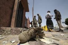 A boot is seen at the site of a bomb blast outside the Houthi-run Saba News Agency in Sanaa, Yemen, June 25, 2015. According to the local media, a guard was killed and two others injured when an explosive device went off in front of the gate of Yemeni Saba News Agency. PHOTO BY REUTERS/Mohamed al-Sayaghi