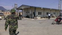Vietnamese border guards patrol outside a Formosa steel mill in Ha Tinh province