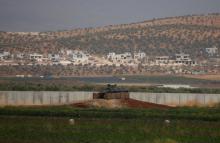 A Turkish military armoured vehicle guards on the border line located opposite the Syrian Atimah, Idlib province in Reyhanli, Hatay province, Turkey, October 8, 2017. PHOTO BY REUTERS/Osman Orsal