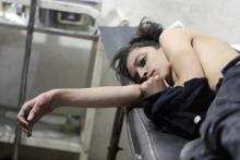 An injured boy lies at a field hospital after what activists said were air strikes by forces of Syria's President Bashar al-Assad in the Duma neighbourhood of Damascus, October 20, 2014. PHOTO BY REUTERS/Badra Mamet