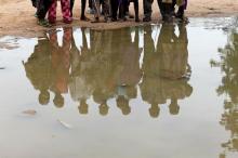 Boys are reflected in water at the internally displaced people's camp in Bama, Borno State Nigeria, August 31, 2016. PHOTO BY REUTERS/Afolabi Sotunde