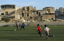 Boys play with a soccer ball in the al-Klaseh neighbourhood of Aleppo, November 8, 2014. PHOTO BY REUTERS/Hosam Katan