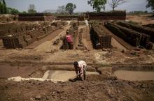 A labourer prepares a mixture for making mud bricks at a kiln in Karjat, India, March 10, 2016. PHOTO BY REUTERS/Danish Siddiqui