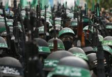 Palestinian members of al-Qassam Brigades, the armed wing of the Hamas movement, take part in a military parade marking the 27th anniversary of Hamas' founding, in Gaza City, December 14, 2014. PHOTO BY REUTERS/Mohammed Salem