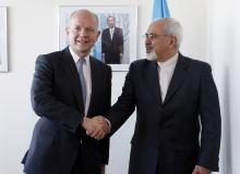 British Foreign Minister William Hague (L). shakes hands with Iran's Foreign Minister Mohammad Javad Zarif