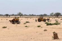 Bulldozers prepare a field for construction on what is slated to be Senegal's largest solar plant in Santhiou Mekhe, Senegal, July 11, 2016. PHOTO BY REUTERS/Nellie Peyton