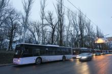 Empty buses, intended for internally displaced persons (IDPs) from the village of Debaltseve, are parked along a roadside, before driving to the village to evacuate the residents, in Makiivka (Makeyevka), eastern Ukraine, February 6, 2015. PHOTO BY REUTERS/Maxim Shemetov