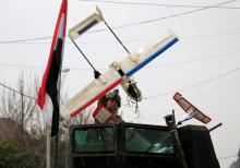 A member of Iraqi Counter-Terrorism Service (CTS) carries aircraft that Islamic State militants left behind during a battle with Islamic State militants in east of Mosul, Iraq, January 21, 2017. PHOTO BY REUTERS/Alaa Al-Marjani