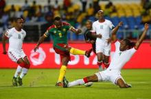 Cameroon's Jacques Zoua Daogari is tackled by Burkina Faso's Bakery Kone in the African Cup of Nations in Stade de l'ball Soccer, Libreville, Gabon, January, 14, 2017. PHOTO BY REUTERS/Mike Hutchings