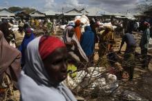 Somali refugees organise their collected ration of food during a distribution exercise outside a United Nations World Food Programme (WFP) centre in Dagahale, one of the several refugee settlements in Dadaab, Garissa County, northeastern Kenya. PHOTO BY REUTERS/Siegfried Modola