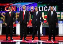 Marco Rubio, Donald Trump, Ted Cruz and John Kasich stand together onstage at the start of the Republican candidates debate sponsored by CNN at the University of Miami in Miami, Florida, March 10, 2016. PHOTO BY REUTERS/Joe Skipper